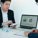 teamwork with business people analysis cost graph on desk at mee