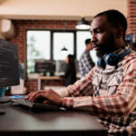freelance coder typing javascript code on computer 2025 02 17 22 07 38 utc