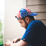 guy wearing american flag inspired hat 2024 12 01 06 30 36 utc